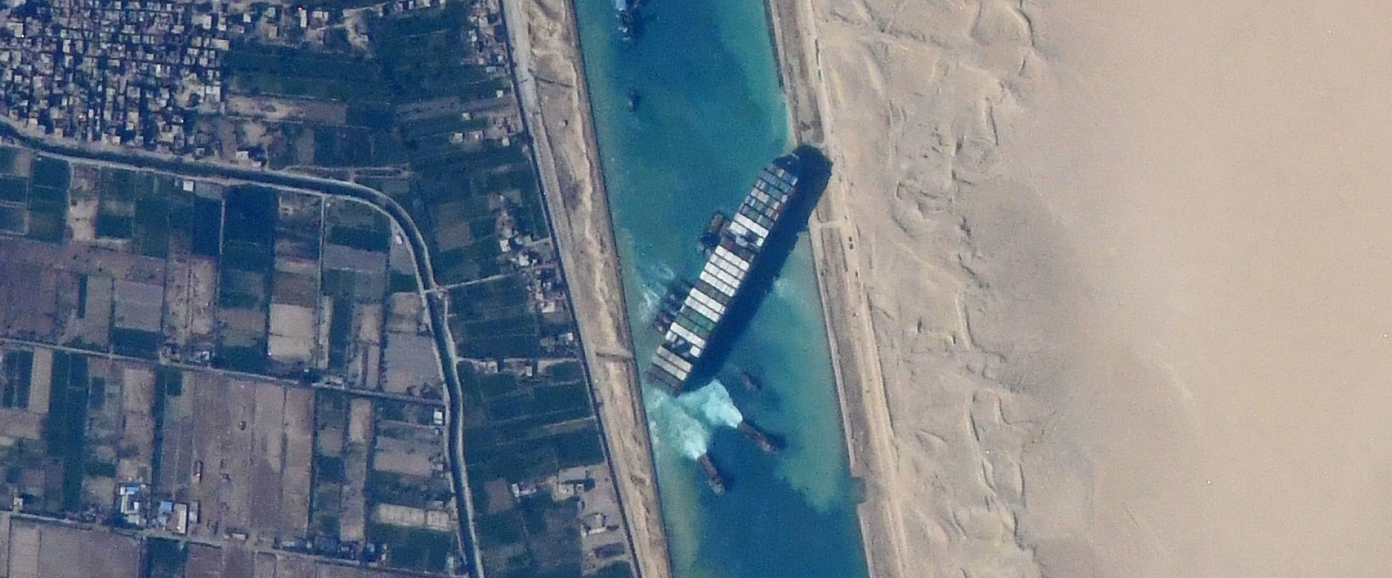 A large freight ship blocking passage of a waterway